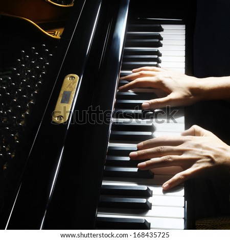 Piano hands pianist playing. Musical instrument grand piano playing details closeup