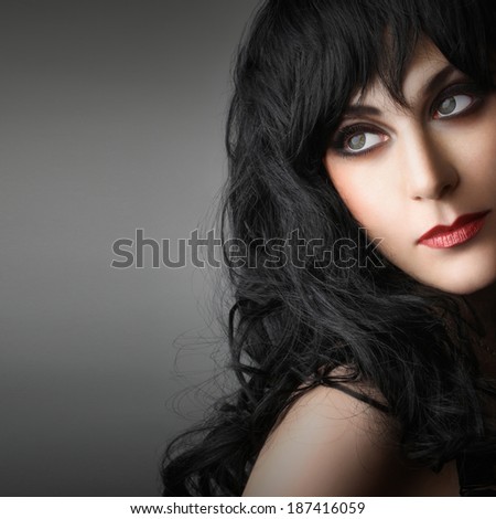 Beautiful woman face close up. Brunette model black hair style