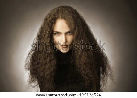 Curly hair woman portrait. Wavy hairstyle model with thick hair style brunette