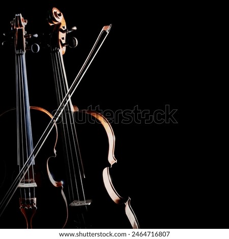 Similar – Foto Bild Nahaufnahme einer Violine mit Bogen. Braune Orchestergeige. Finger auf der Tastatur der Violine.