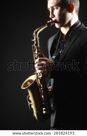 Saxophone Player Saxophonist jazz man with Sax alto close up