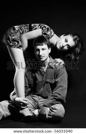 Beautiful couple on black background. Classical black and white art-photo.