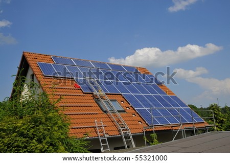 Construction of a photovoltaic system on a rooftop.