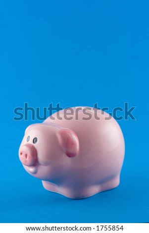 A pottery money box in the shape of a pig