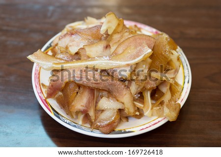 Plate of Traditional Taiwan beer snack: pig ears.