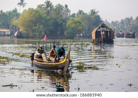 KOCHIN, INDIA-FEBRUARY 24: Hindu on the boat on February 24, 2013 in Kochin, India. Hindu man go by boat suburb of Cochin