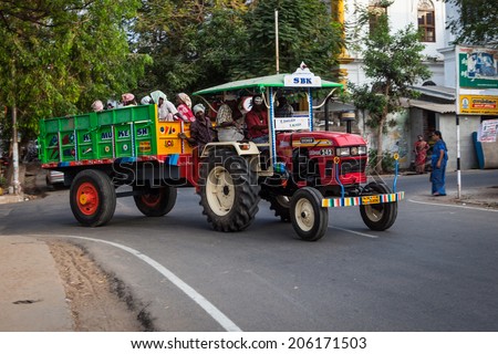 PONDICHERRY, INDIA-FEBRUARY 12: Tractor on the street of Indian city feb 12, 2013 in Pondicherry, India. Tractor-trailer driven by Indian workers.