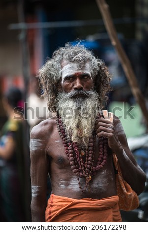 TRICHY, INDIA-FEBRUARY 14: Indian old man feb 14, 2013 in Trichy, India. The old man on the street of Indian town.