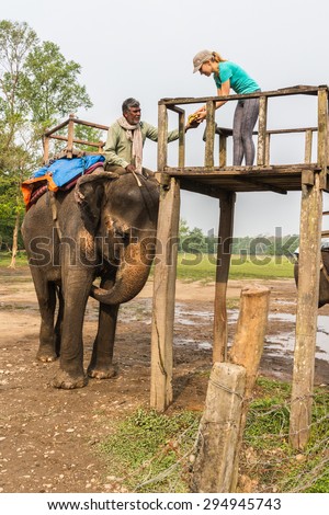 CHITWAN, NEPAL-MARCH 27, 2015: Elephant safari in Chitwan, Nepal. Elephant ride in the Chitwan National Park.