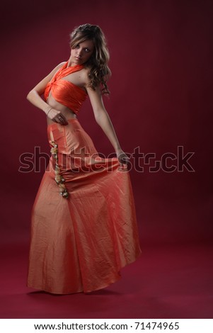 Young elegance woman in a dress dance
