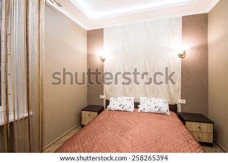 Hotel room. Small bedroom with double bed. Modern interior room