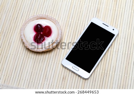 Morning Mood, where on a light table is a phone with Cake