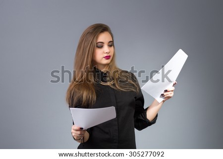 Woman manager - businesswoman holding papers in hands