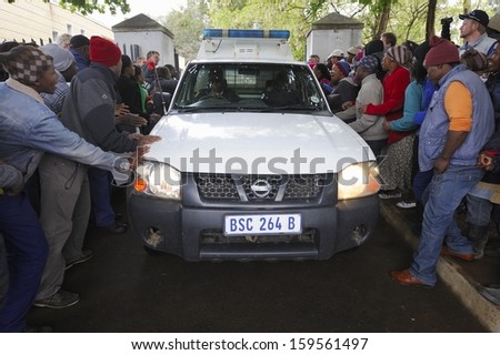 UNDERBERG, SOUTH AFRICA  OCTOBER 22: Community demonstates at Himeville Court as suspects in the macabre murder of Dan Knight are arraigned on October 22, 2013 -  Kwazulu Natal, South Africa.