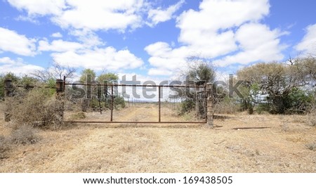 Farm Gate. Typical sheep camp on a Karroo farm, Graaff Reinett, South Africa. The veld in this arid, semi-desert  sheep farming region is divided into large camps using jackal-proof fencing