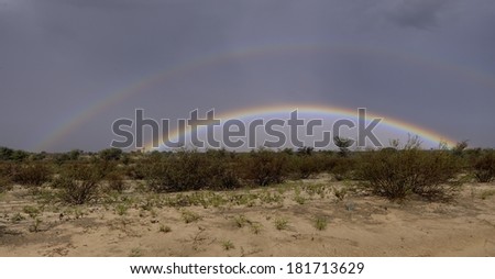 Rare double rainbow during a thundershower in the Kalahari Desert, South Africa. 9 frame exposure stack.