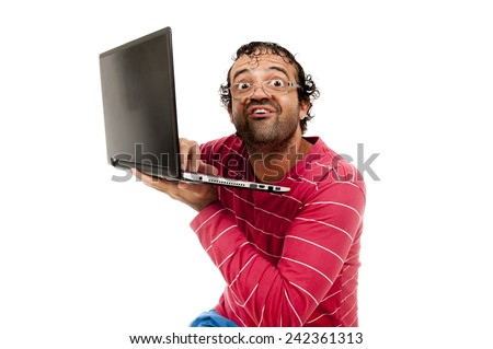 Smart Ugly man with glasses using a laptop