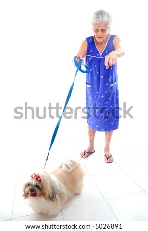 Elderly with her pet on white floor .