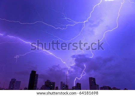 Thunder storm and power Lightning over city .