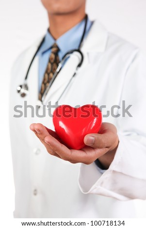 Medical Doctor with red heart in hand.