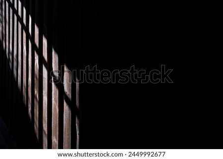 Similar – Image, Stock Photo Some sunlight falls into an archway and illuminates the headscarf and robe of a statue of the Holy Mary Mother of God in front of a pale blue sky and shadowy branches in the background