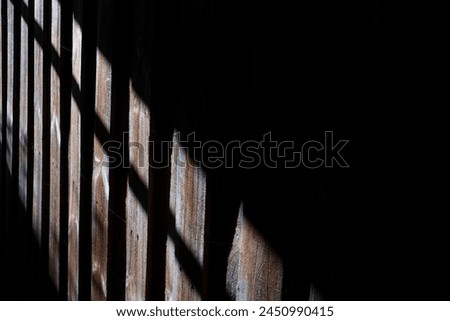 Similar – Image, Stock Photo Some sunlight falls into an archway and illuminates the headscarf and robe of a statue of the Holy Mary Mother of God in front of a pale blue sky and shadowy branches in the background