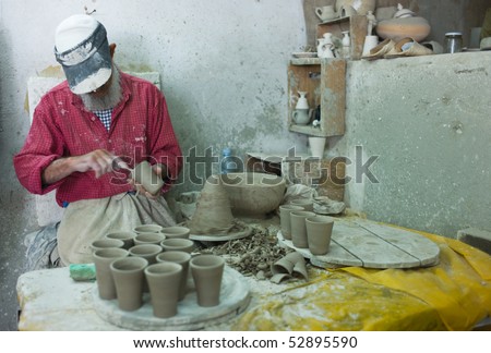 FES - APRIL 17: Morrocan man shapes pottery  April 17, 2010 in Fes, Morocco.