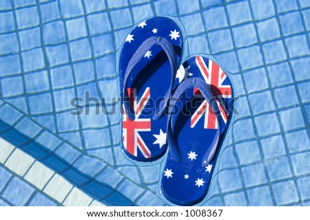 Pair of sandals printed with the Australian flag floating on a pool.