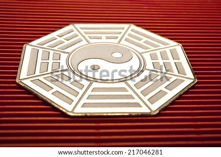 metal plate with I-ching and yin yang symbols