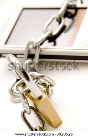 pocket pc tied with a chain and lock concept for security in computer