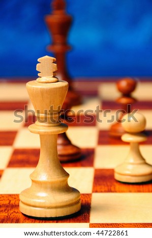 black and white chess kings and pawns confronting on the chess board