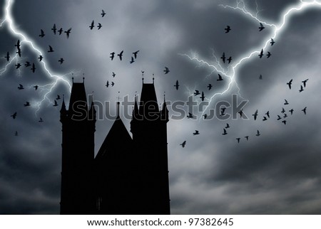a stormy sky with gothic towers and crows flying
