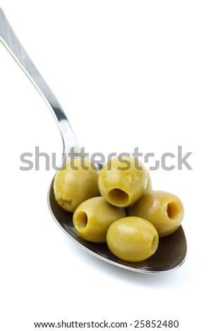 Five marinated pitted green olives in the metal spoon isolated on the white background