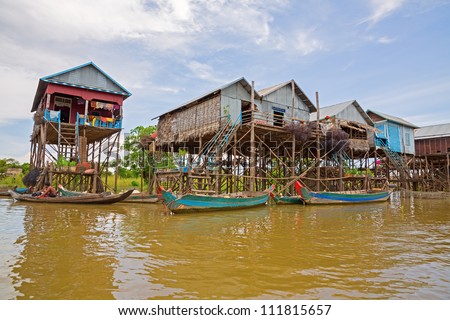 Homes On Stilts On The Floating Village Of Kampong Phluk, Tonle Sap ...