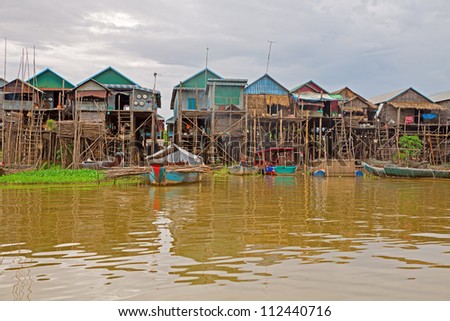 Homes On Stilts On The Floating Village Of Kampong Phluk, Tonle Sap ...