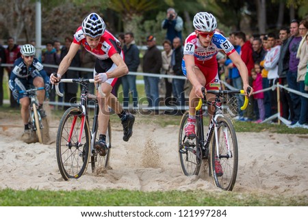 VALENCIA - DECEMBER 16: Aitor Hernandez (left and finally winner) and Yorben Van Tichelt (right) participate in XXVII edition of Cyclo-cross city of Valencia on December 16, 2012 in Valencia, Spain