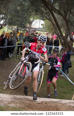 VALENCIA - DECEMBER 16: Aitor Hernandez (number 4, and finally winner) participates in XXVII edition of Cyclo-cross city of Valencia on December 16, 2012 in Valencia, Spain