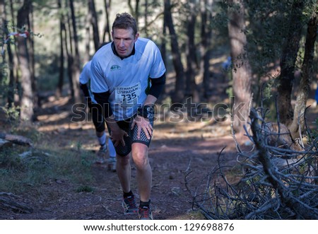 CASTELLON - FEBRUARY 24: Carlos Perez Granero (number 735) leads group in his participation in XV Edition of Espadan mountain marathon on February 24, 2013 in Castellon, Spain