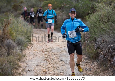 CASTELLON - FEBRUARY 24: Francisco Martinez Antoli (number 855) leads group in his participation in XV Edition of Espadan mountain marathon on February 24, 2013 in Castellon, Spain
