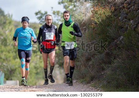 CASTELLON - FEBRUARY 24: Miguel Martin Illescas (number 327) leads group in his participation in XV Edition of Espadan mountain marathon on February 24, 2013 in Castellon, Spain