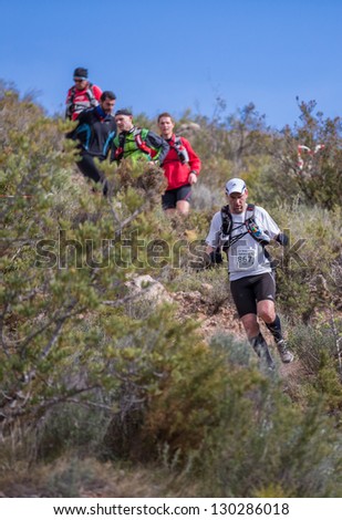 CASTELLON - FEBRUARY 24: David Roures Roig (number 867) leads group in his participation in XV Edition of Espadan mountain marathon on February 24, 2013 in Castellon, Spain