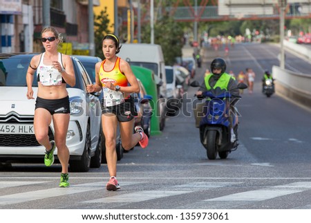 VALENCIA - APRIL 21: Fatima Ayachi (number 6) and Raquel Landin (number 1) lead race during women race against cancer in Valencias on April 21, 2013 in Valencia, Spain