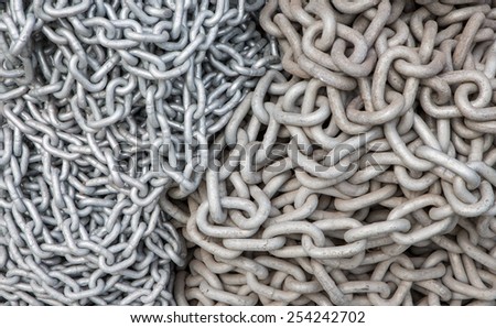 Top view of old and new chains with big and small links, background