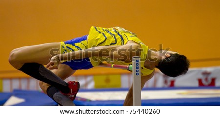 VALENCIA, SPAIN - FEBRUARY 20: Closeup of High jump competitor of high jump Men of the spanish indoor national championships at Valencia on February 20, 2011 in Valencia, Spain