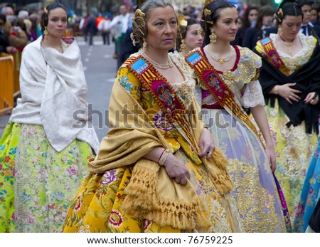 VALENCIA, SPAIN - MARCH 16: Women walking in the presentation of the fallas, one of the biggest parties in Spain where people dresses traditionally on march 16, 2011 in Valencia, Spain