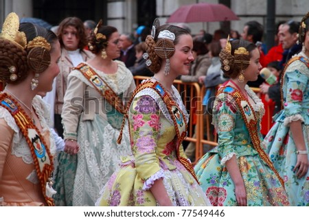 VALENCIA, SPAIN - MARCH 16: Several unidentified women walk in the presentation of the Fallas, one of the biggest parties in Spain where people dress in vintage clothing on March 16, 2011 in Valencia, Spain