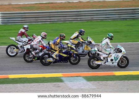 CHESTE, SPAIN - NOVEMBER 6: All categories of drivers and Kevin Schwantz's tribute to Marco Simoncelli ride a lap in his memory at final race of Grand Prix 2011 on November 6, 2011 in Cheste (Valencia), Spain