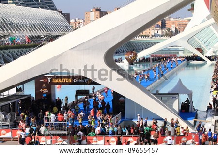 VALENCIA - NOVEMBER 27: Runners at Finish line of Marathon race at the incredible environment of Palace of Arts, Santiago Calatrava\'s architect famous buildings on November 27, 2011 in Valencia, Spain