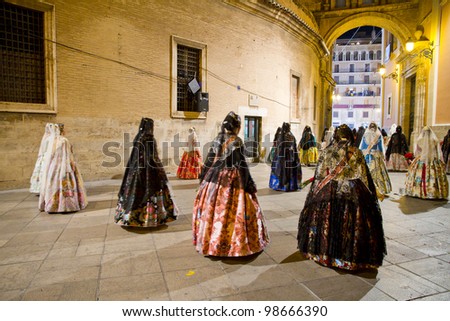 VALENCIA, SPAIN - MARCH 19: Several unidentified women walk in the offering of  Fallas, one of the biggest parties in Spain where people dress in vintage clothing on March 19, 2012 in Valencia, Spain