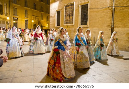 VALENCIA, SPAIN - MARCH 19: Several unidentified women walk in the offering of  Fallas, one of the biggest parties in Spain where people dress in vintage clothing on March 19, 2012 in Valencia, Spain